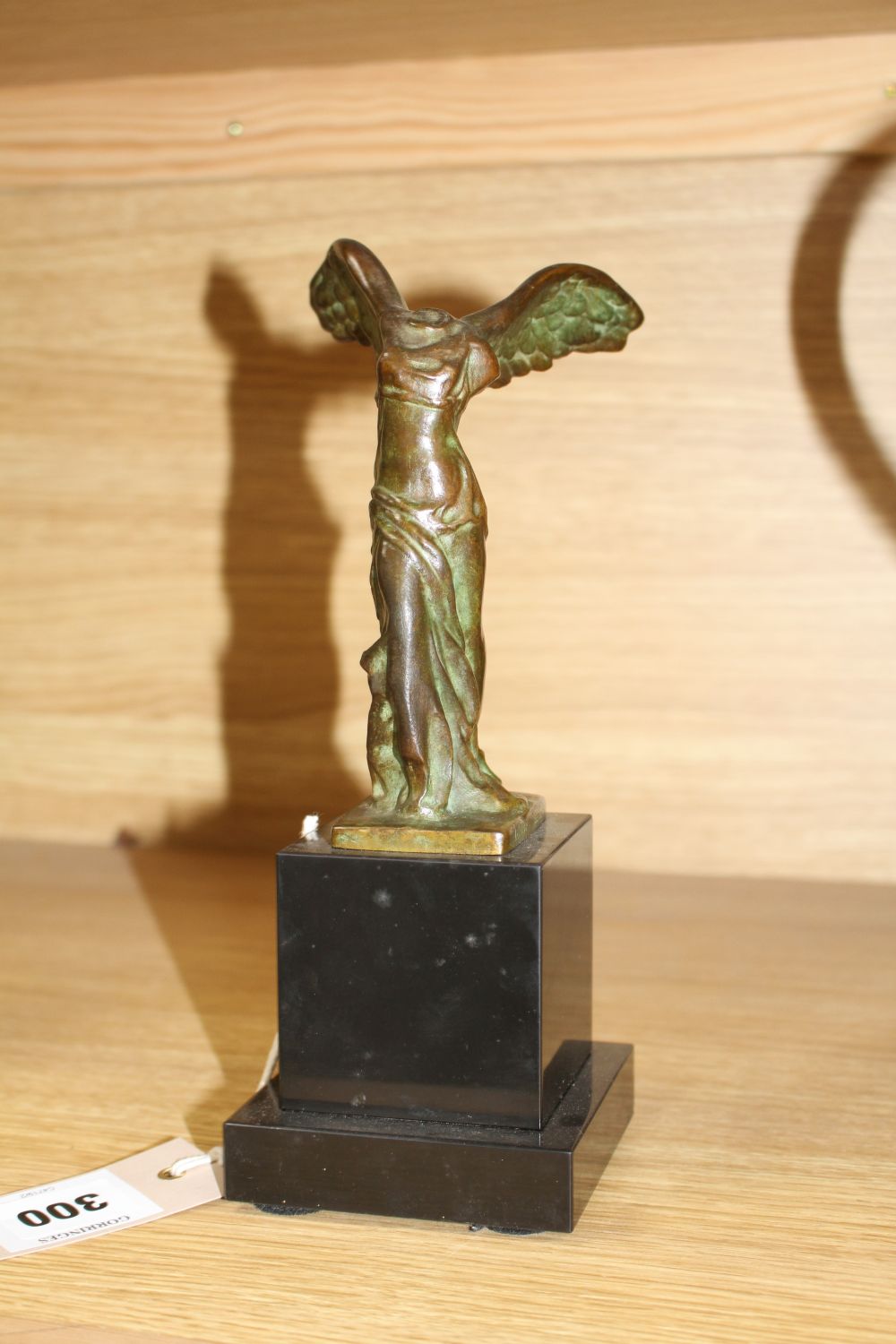 Max Le Verrier (1891-1973). A bronze group La Victoire de Samothrace, on black marble plinth, overall height 23.5cm